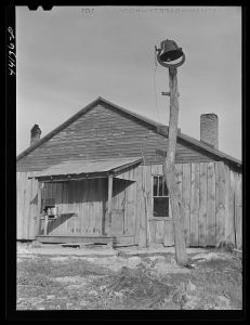 Tenant house and plantation bell. Heard County, Georgia