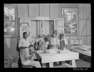Negro youngsters learning how to sharpen saws in a new vocational school. Greene County, Georgia