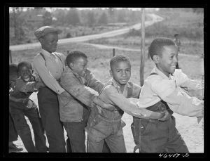 Boyd Jones, playing tug-of-war with class mates during play period at the Alexander Community School in Greene County, Georgia