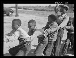 Boyd Jones, playing tug-of-war with classmates during play period at the Alexander Community School in Greene County, Georgia