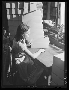 [Untitled photo, possibly related to: Making boxes to pack socks in the textile mill in Union Point, Greene County, Georgia]