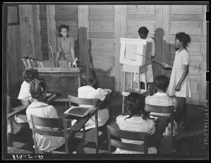 Fourth and fifth grades in Flint River School, Georgia, demonstrating a health moving picture which they made
