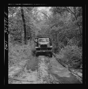 [Untitled photo, possibly related to: Warner Robins, Georgia. Air Service Command, Robins Field. Part of the training of the truck drivers of the depot group consists of driving many times through an obstacle course in the woods]
