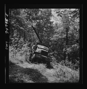 [Untitled photo, possibly related to: Warner Robins, Georgia. Air Service Command, Robins Field. Part of the training of the truck drivers of the depot group consists of driving many times through an obstacle course in the woods]