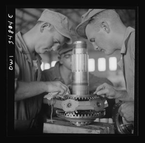 [Untitled photo, possibly related to: Warner Robins, Georgia. Air Service Command, Robins Field. Assembling the nose of a Pratt and Whitney engine]