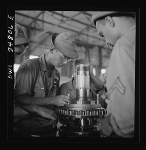 [Untitled photo, possibly related to: Warner Robins, Georgia. Air Service Command, Robins Field. Assembling the nose of a Pratt and Whitney engine]