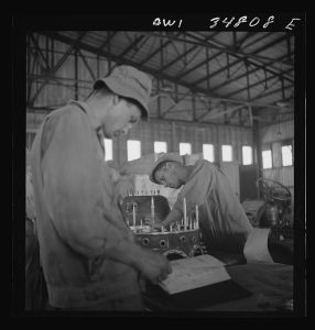 [Untitled photo, possibly related to: Warner Robins, Georgia. Air Service Command, Robins Field. Assembling the nose of a Pratt and Whitney engine]