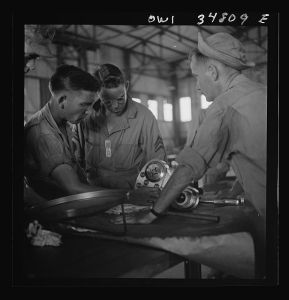 [Untitled photo, possibly related to: Warner Robins, Georgia. Air Service Command, Robins Field. Assembling the nose of a Pratt and Whitney engine]