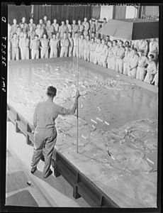 [Untitled photo, possibly related to: Warner Robins, Georgia. Air Service Command. A class at the staff and command school carrying on a discussion of a service command problem in the Northern European Theater]