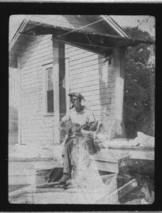 [Bill Tatnall, sitting with guitar, Frederica, Georgia]