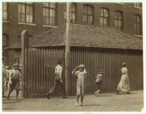 Noon hour at Massachusetts Mill, Lindale Ga. During the days following this, I proved the ages of nearly a dozen of these children, by gaining access to Family Records, Life Insurance papers, and through conversations with the children and parents, and found these that I could prove to be working now, or during the past year at 10 and 11 years of age, some of them having begun before they were ten. Further search would reveal dozens more. (See Hine Report). Location: Lindale, Georgia.