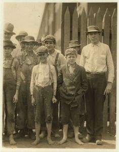 Noon hour at Massachusetts Mill, Lindale, Ga. During the days following this, I proved the ages of nearly a dozen of these children, by gaining access to Family Records, Insurance papers, and through conversations with the children and parents, and found these that I could prove to be working now, or during the past year, at 10 and 11 years of age, some of them having begun before they were ten. Further search would reveal dozens or more. (See Hine Report). Lindale, Georgia.