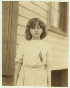 Ada Griffith, a very young spinner in Massachusetts Mills, Lindale, Ga. Runs 4 sides. Apparently under 12. Location: Lindale, Georgia.