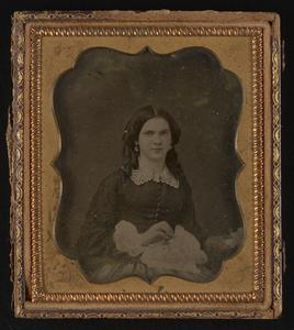 Miniature of woman sewing in gold frame