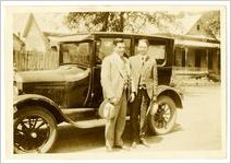 Photograph of two men in front of a car, Commerce, Georgia