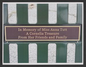 Two color photographs of bench with a plaque honoring Cornelia, Georgia's Miss Anna Tutt