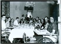 Photograph of a group of patients having dinner in the private dining room in Georgia Hall at the Georgia Warm Springs Foundation, Warm Springs, Meriwether County, Georgia