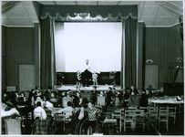 Photograph of Georgia Warm Springs Foundation patients and staff watching a live performance on the playhouse stage at the Georgia Warm Springs Foundation, Warm Springs, Meriwether County, Georgia, 1930-1940?