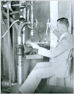 Photograph of an orthopedic brace maker using a drill press at the Georgia Warm Springs Foundation, Warm Springs, Meriwether County, Georgia, 1930-1940?