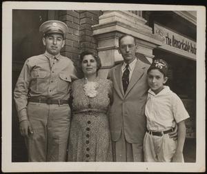 George, Milady, Mike Sr., and Mike Jr. in front of Rylander Theatre