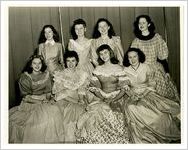 Photograph of eight women wearing ball gowns, Sylvania, Georgia, 1947