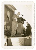 Photograph of Clyde Hollingsworth onstage at Sylvania Centennial celebration, Sylvania, Georgia, 1947