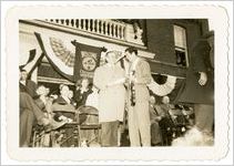 Photograph of Governor Melvin E. Thompson and Roy Acuff on stage at Sylvania Centennial celebration, Sylvania, Georgia, 1947