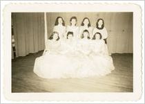 Photograph of eight women wearing ball gowns, Sylvania, Georgia, 1947