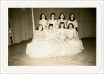 Photograph of eight women wearing ball gowns, Sylvania, Georgia, 1947