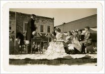 Photograph of men and women in costume on a parade float, Sylvania, Georgia, 1947