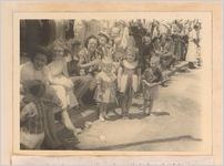 Photograph of people gathered along a sidewalk to watch a parade, Sylvania, Georgia, 1951