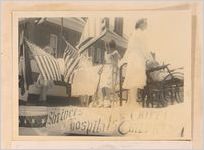 Photograph of disabled children riding a float at a local parade, Sylvania, Georgia, 1951