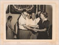 Photograph of a public health nurse taking blood from Sylvania mayor Willard H. Lariscy, Sylvania, Georgia, 1951