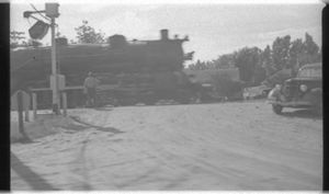 Steam Locomotive Crossing Street