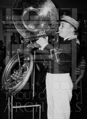 Unidentified CEA band member playing a trumpet