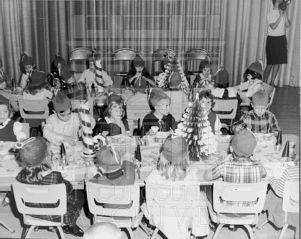 CEA Kindergarten students and teacher at a holiday class party