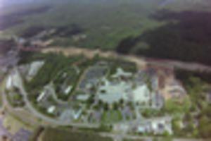 Picture of buildings and dirt road from sky view