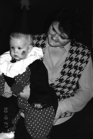 Woman with child dressed as clown