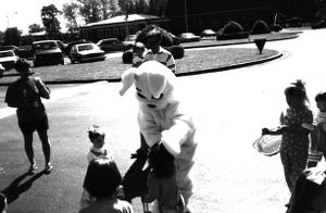 Easter Bunny and children at the Easter egg hunt