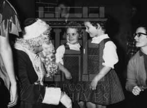 CEA student and adult visit with Santa Claus