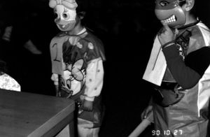 Two children in Halloween costumes