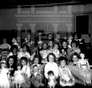 CEA Kindergarten students group photo with dolls
