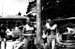 Two girls stand next to CEA Pool