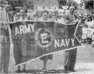 Unidentified people with Army, Navy pennant