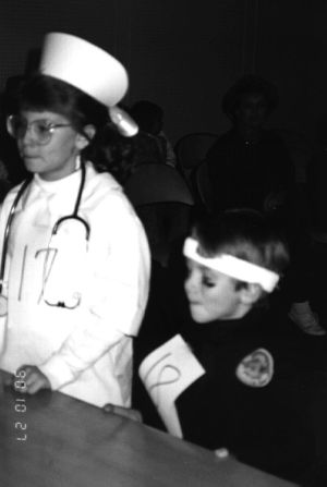 Two children in Halloween costumes