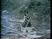 WORK TO CLEAR DAMAGE DONE TO VILLAGE (1960)