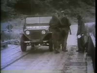 U.S. TROOPS WRECK JEEP AT BRIDGE BUILT BY ARMY