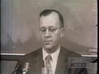 WSB-TV newsfilm clip of a man discussing whether a dog, probably Russian space dog Laika, is likely to return from a flight alive, probably in November 1957