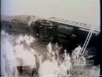 RESCUE WORKERS AID VICTIMS OF TRAIN WRECK