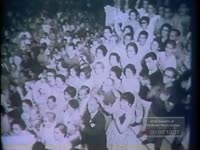 Unidentified white male speaker at large anti-communist rally